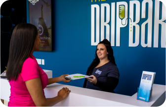 A lady signing up at the front desk