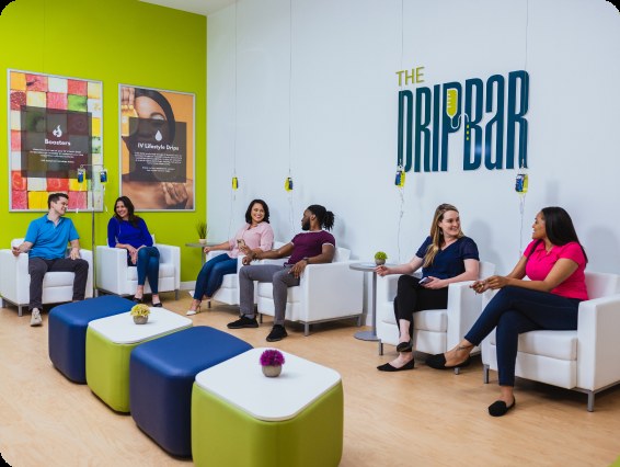 Guests relaxing in the lounge at The DRIPBaR Brooksville, FL